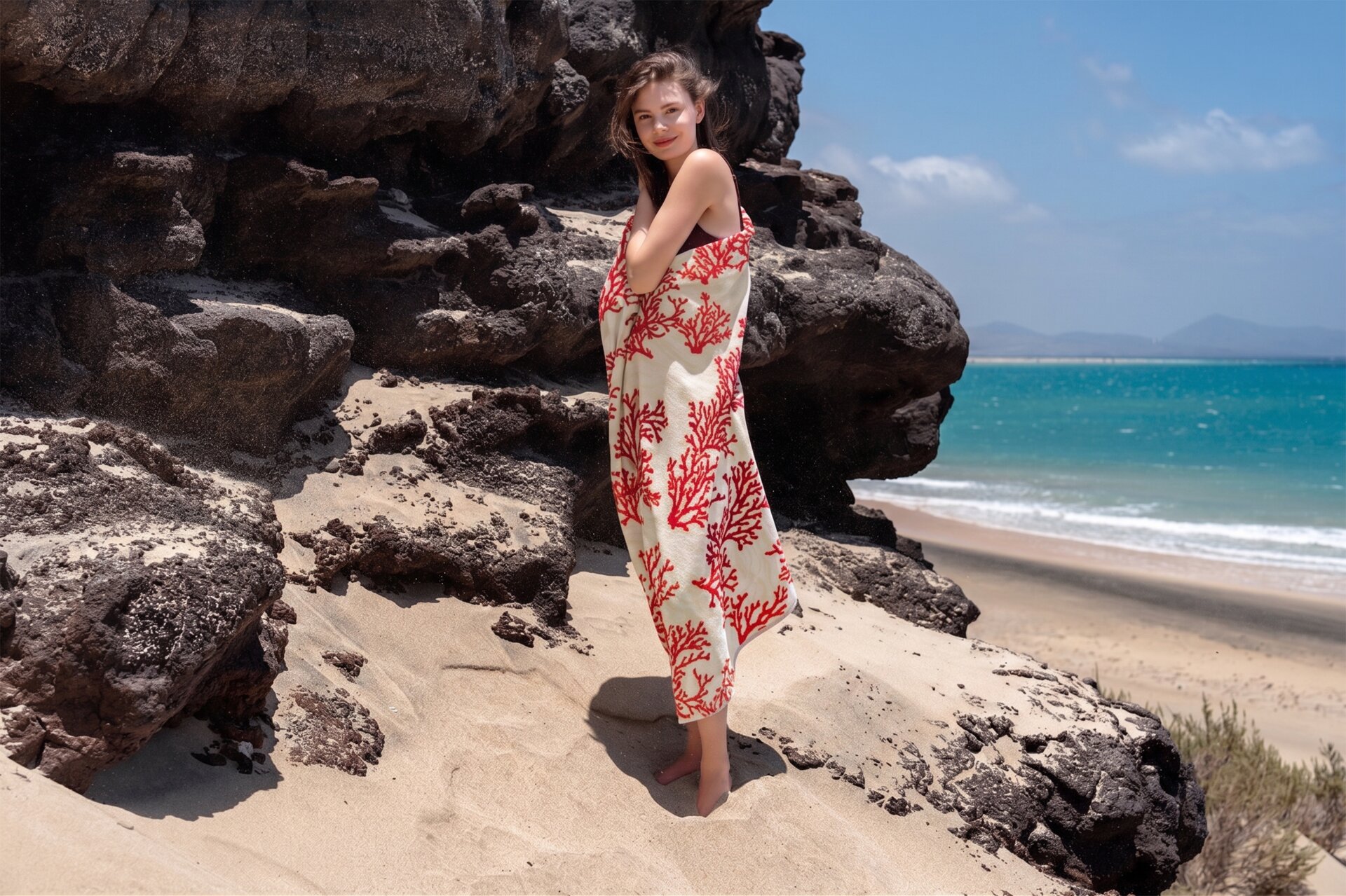 Exclusive FEILER hand towel, model shows coral design, made from Original FEILER chenille, Made in Germany.