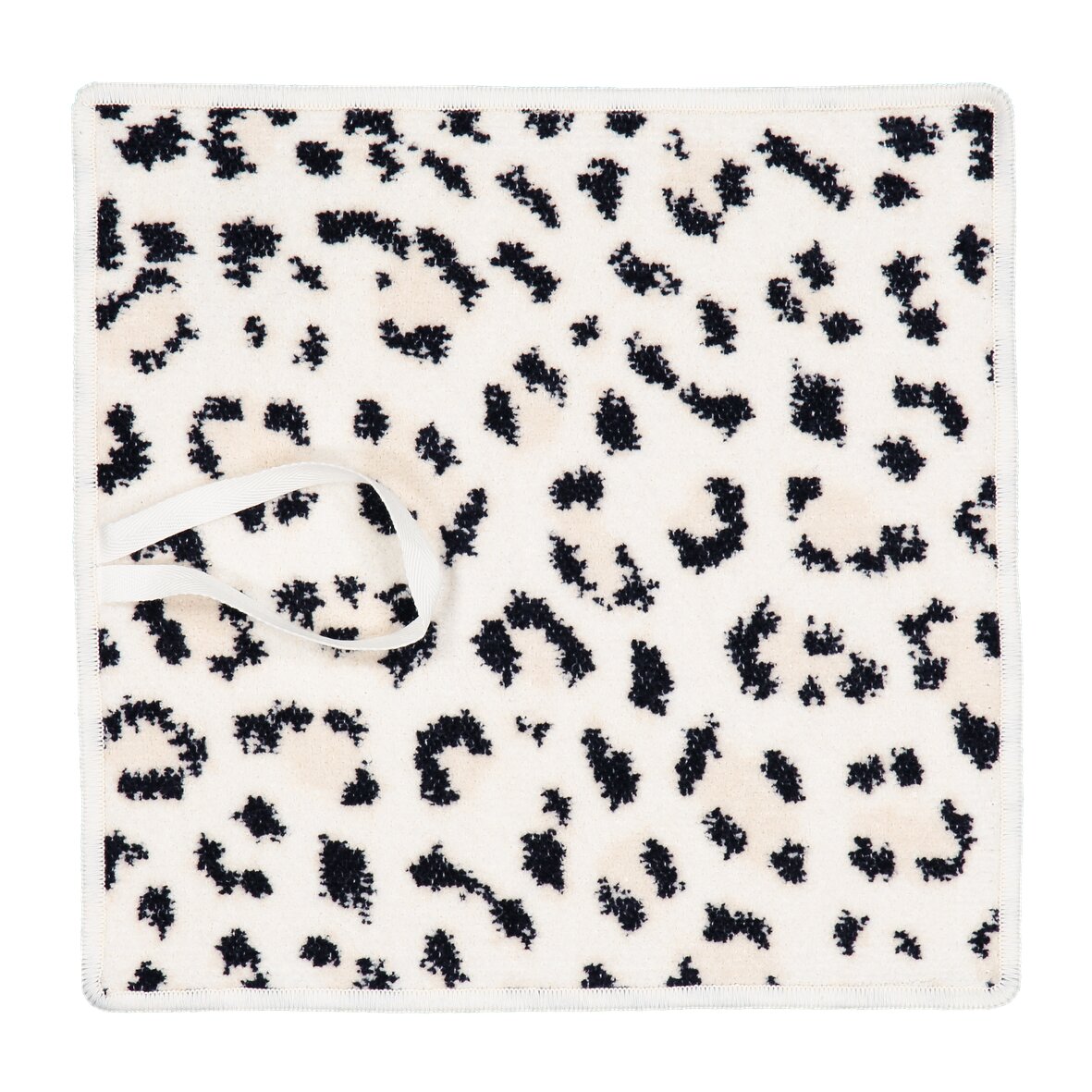 White chenille fabric with black leopard print pattern, no model present.