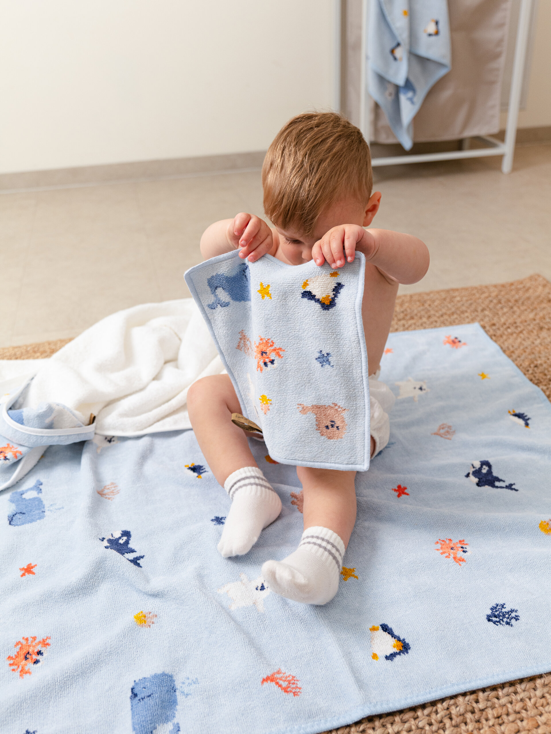 Lifestyle view featuring the FEILER Face Cloth from the POLAR FRIENDS collection, made from Original FEILER chenille in Germany, lifestyle image.