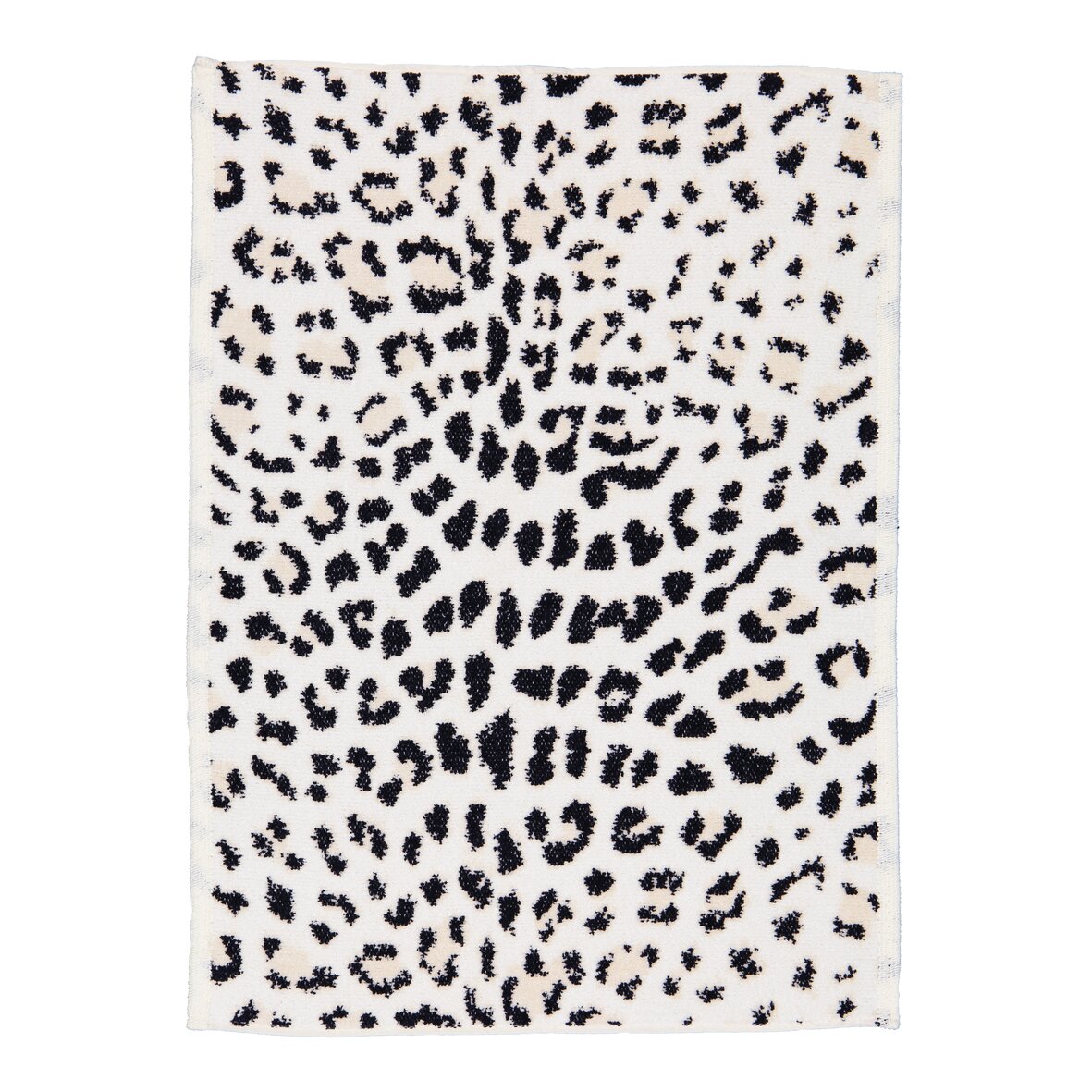 Textile with black and white abstract pattern, resembling animal print. Luxurious chenille fabric.