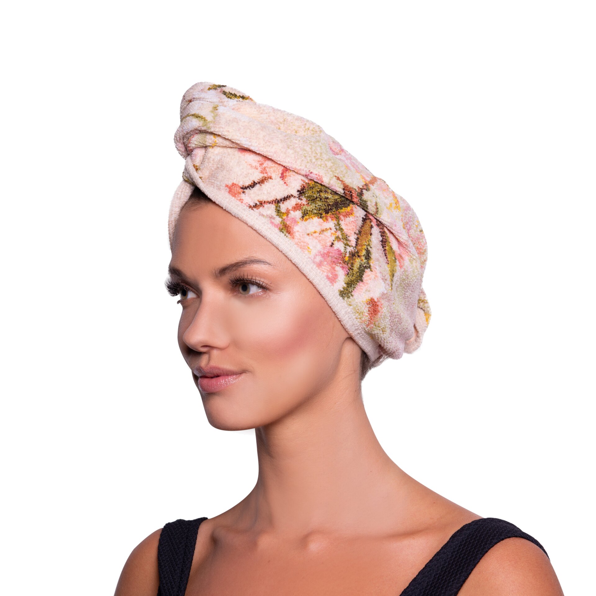 Adult woman with floral chenille fabric wrapped around head, displaying delicate pink and green pattern.