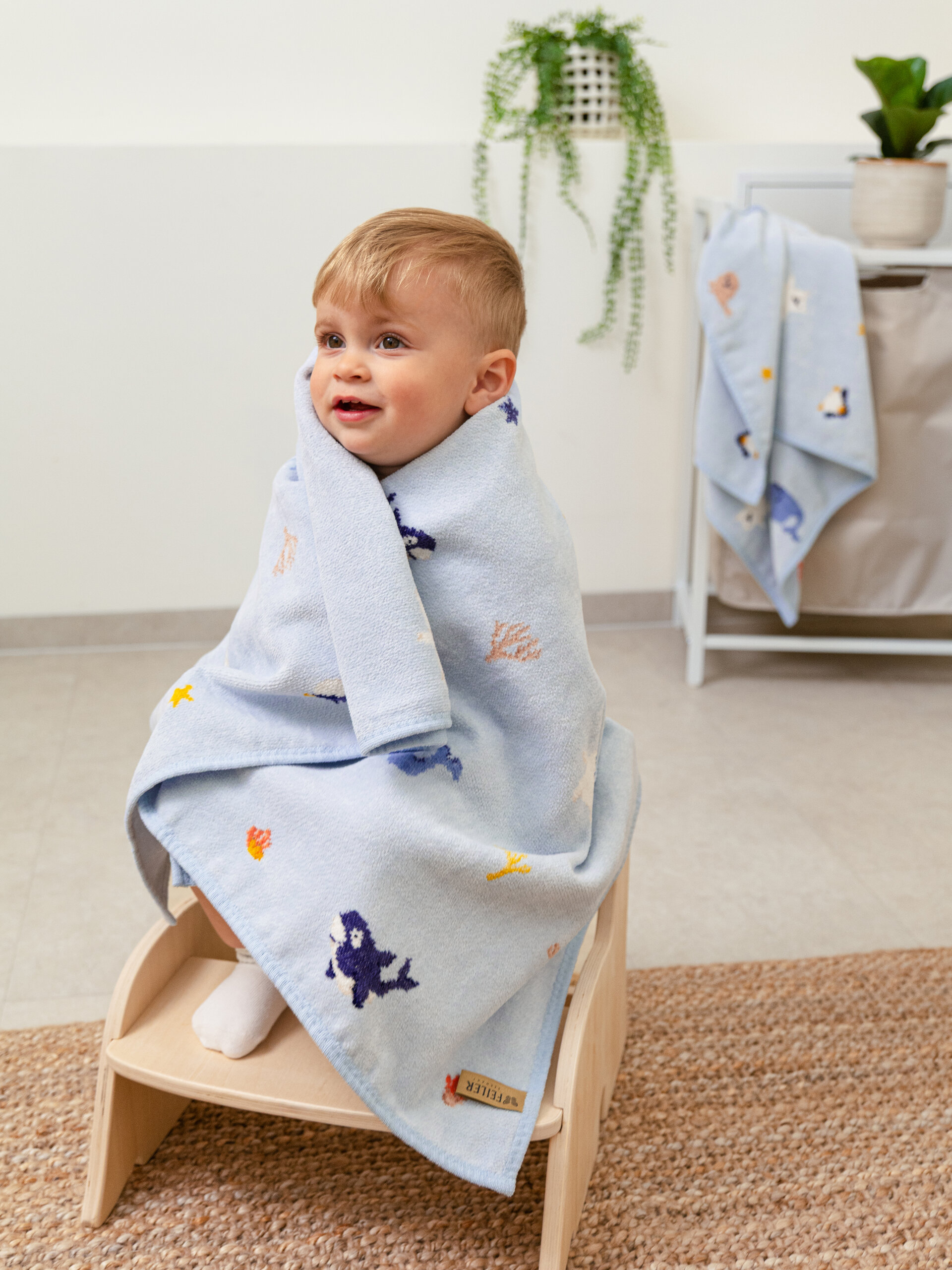 Lifestyle view featuring the FEILER Blanket from the POLAR FRIENDS collection, made from Original FEILER chenille in Germany.
