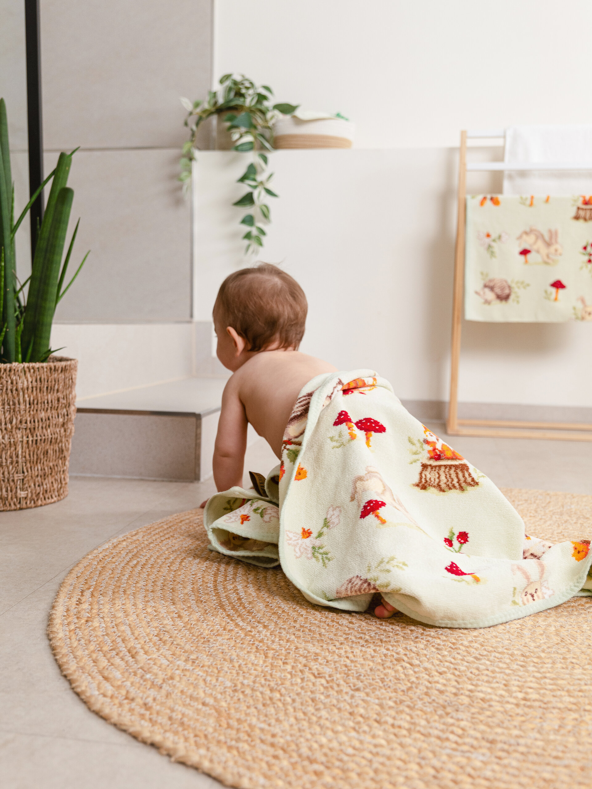 Lifestyle view featuring the FEILER Baby Blanket from the FOREST TALES collection, made from Original FEILER chenille in Germany.